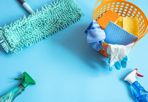 Professional cleaning supplies laid out for a cleaning guide